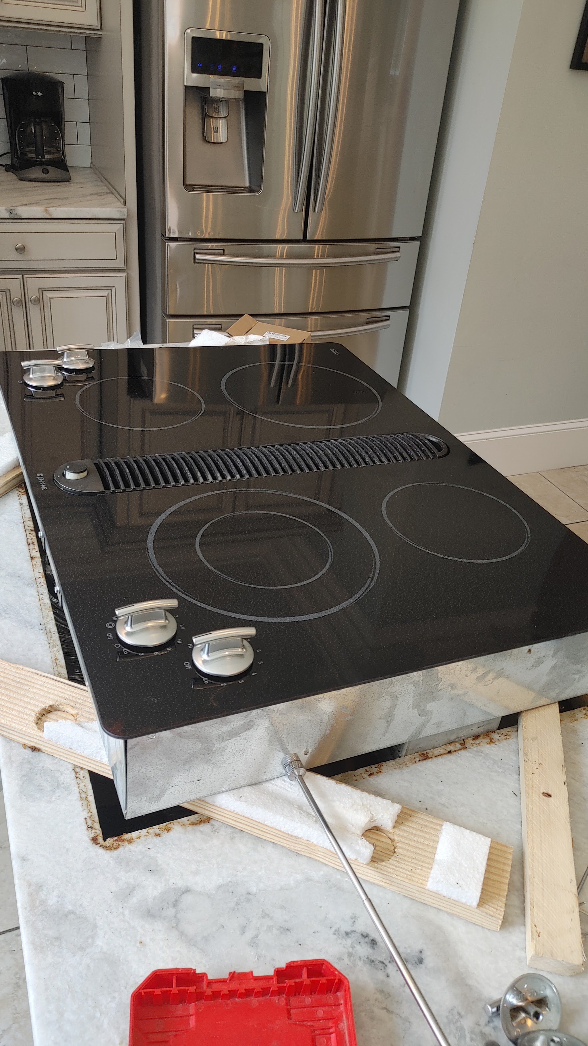 Glass cooktop being installed